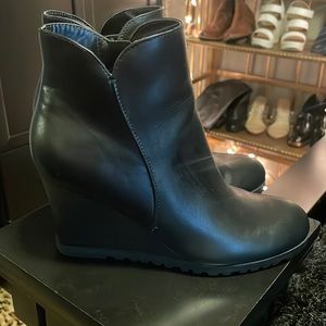 Black wedge ankle bootie in excellent condition worn once